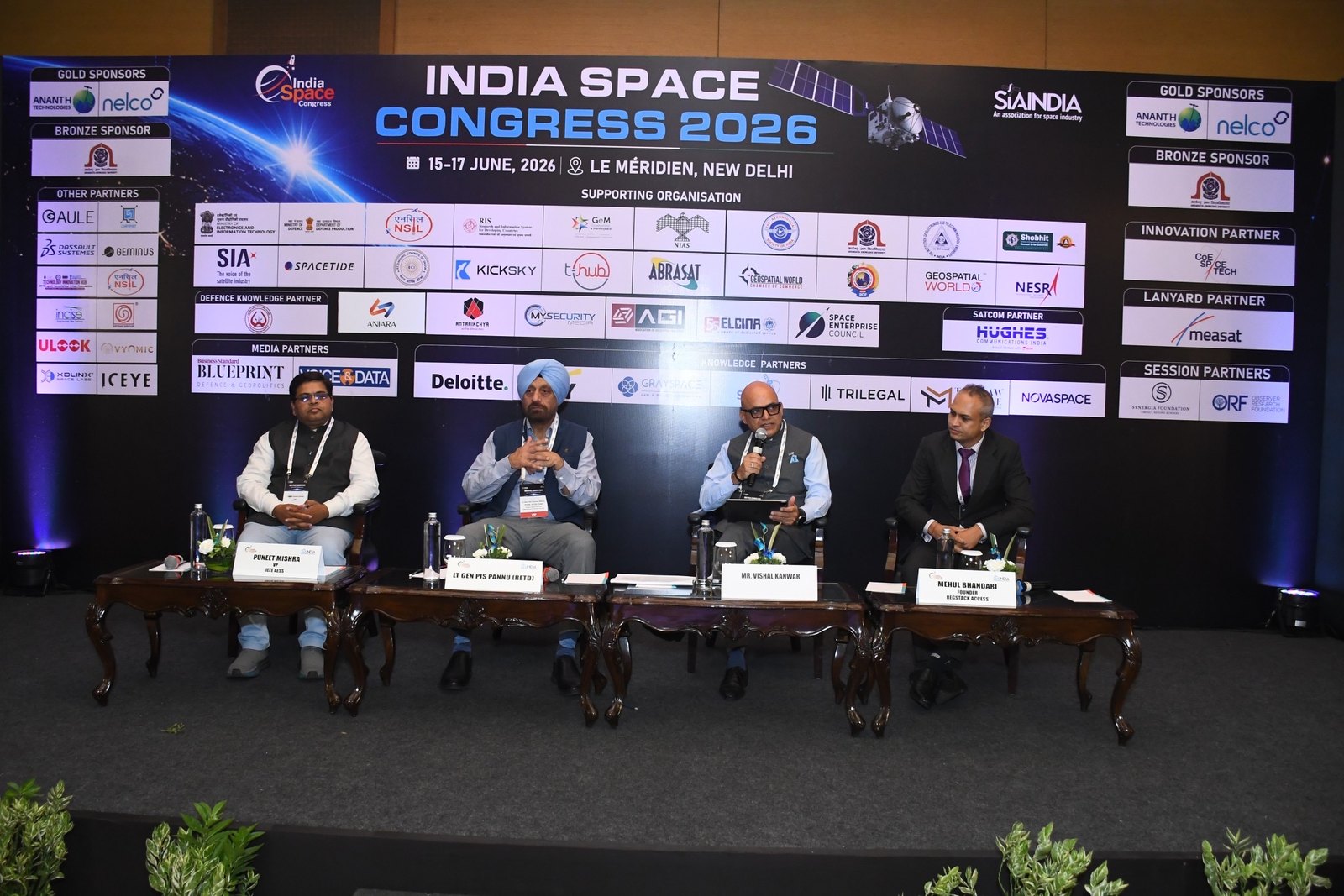 The 5G/6G-NTN panel at India Space Congress 2026 in New Delhi: Puneet Mishra of IEEE AESS, Lt Gen PJS Pannu (Retd), moderator Capt Vishal Kanwar (Retd) of PwC, and Mehul Bhandari of RegStack Access.